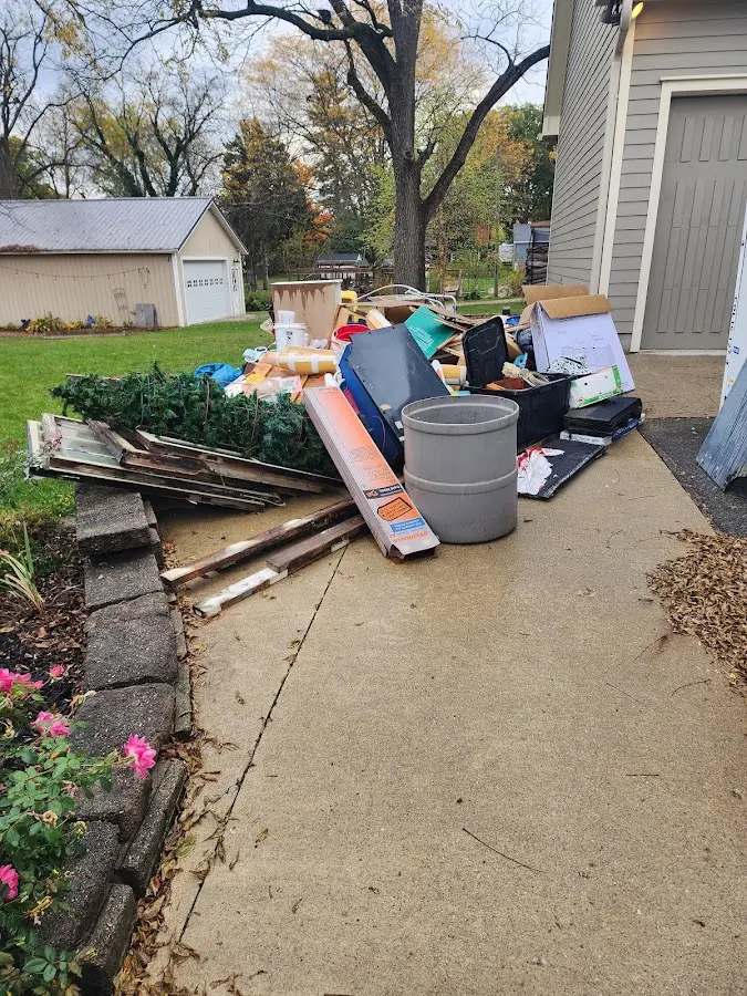 Dumpster being loaded with debris for Demolition Dumpster Rental in Oak Hill